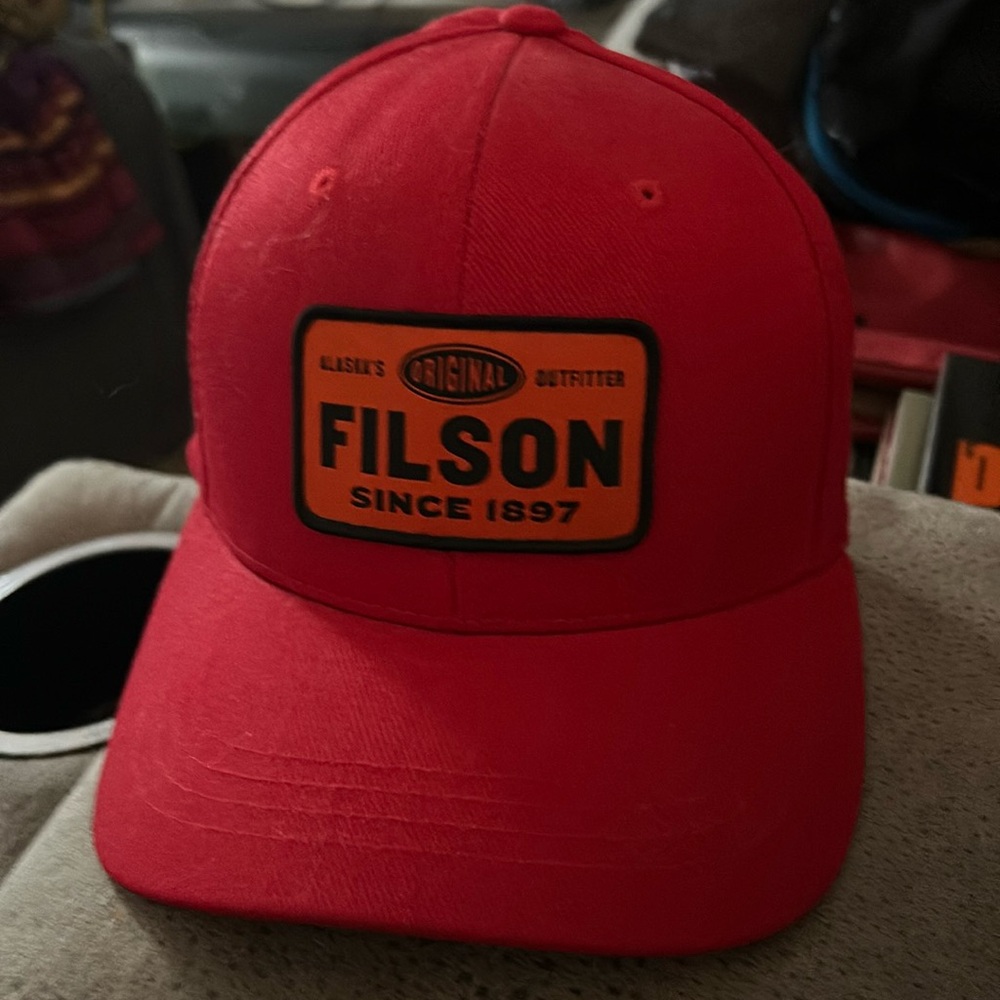 Filson Red Hat with Leather Strap closer. Patch Orange